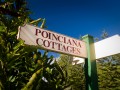 Poinciana Cottages sign